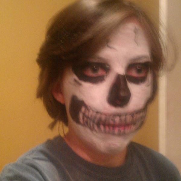 My first try at skeleton make up. I used cheap ass Halloween grease paint and a liquid eye liner pen. I'm telling my fiance tomorrow that I need some real make up, I tried to tell him that earlier but nooo we had to get the make up that makes my face feel like it's suffocating. Whatever...other than the teeth I think it doesn't look as horrible as I thought my first try would be.